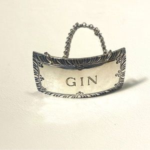 Stieff sterling silver liquor decanter hang tag.